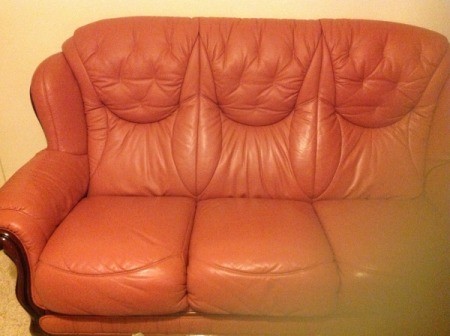 Rose colored leather couch.