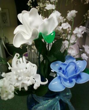 Blue and white spoon flowers, white fork flower in vase with artificial flowers.