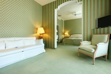 Wallpaper installed over wood paneling.