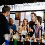Young people drinking at a pub.