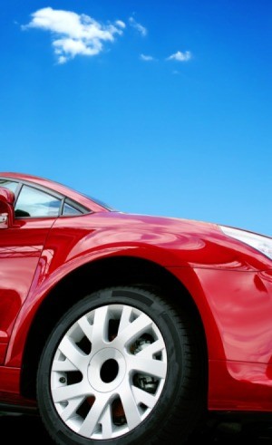 A car set against beautiful blue sky.