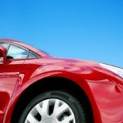 A car set against beautiful blue sky.