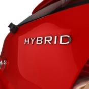 The back of a red hybrid car.