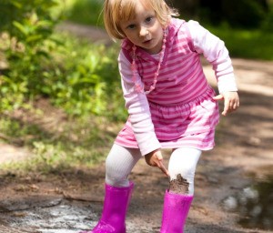 A girl with mud stains on her clothing.