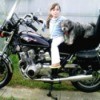 Yoda (Shih Tzu) - Young girl and dog sitting on a motorcycle.