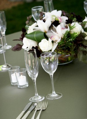 Wedding rehearsal table with a nice floral centerpiece.