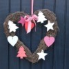 Heart shaped wreath on a door.