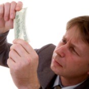 A man inspecting money.