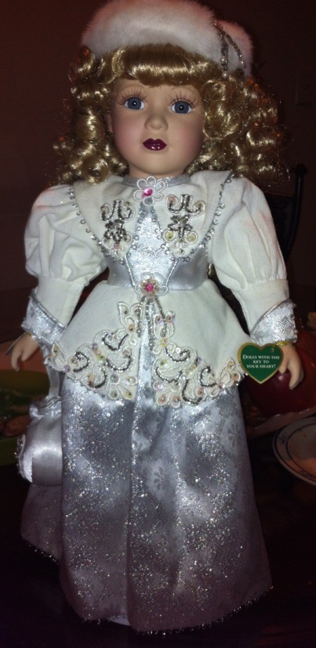 Full view of doll and detail on dress.