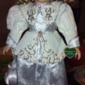 Full view of doll and detail on dress.