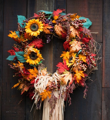 Autumn wreath made of flowers and leaves.