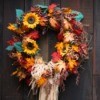 Autumn wreath made of flowers and leaves.