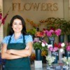 Female florist standing in her shop.