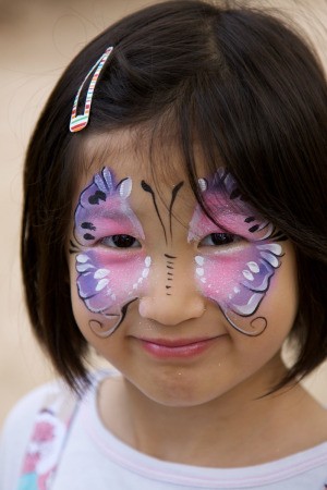Young girl with face paint on.