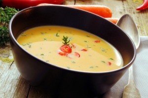 A bowl of carrot soup.