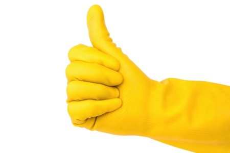 Rubber cleaning glove giving a thumbs up.