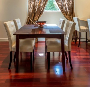 A dining room with hardwood floors.