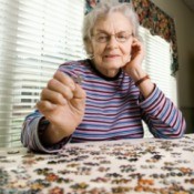 A woman working on a puzzle.