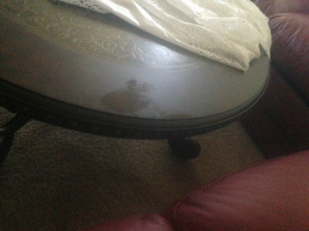 Table with damaged finish.