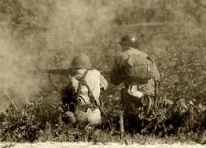 Two soldiers photographed fighting in WW II.