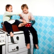 Boys Sitting on Counter in Kitchen