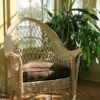 Wicker chair in a sunroom.