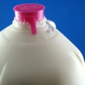 Plastic milk bottle with an expiration date on it.