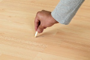 Fixing a scratch on laminate flooring.