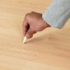 Fixing a scratch on laminate flooring.