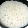 Rice in a cast iron pan.