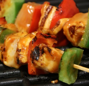 Grilling kabobs for a summer party.