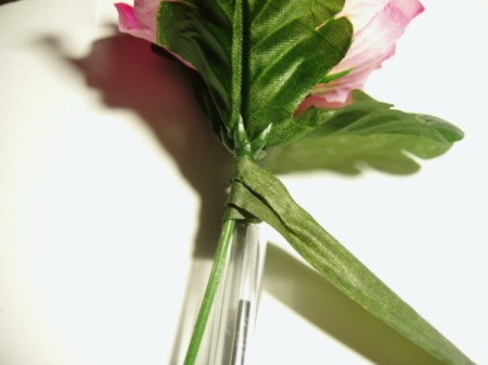 Wrapping floral tape around stem.