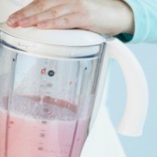 Blender being used to make a smoothie.