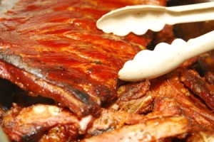 Serving bbq ribs to a large group.