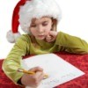 A girl writing a Christmas wish list.