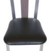 Dining room chair with a vinyl seat.