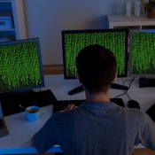 Hacker sitting streaming data