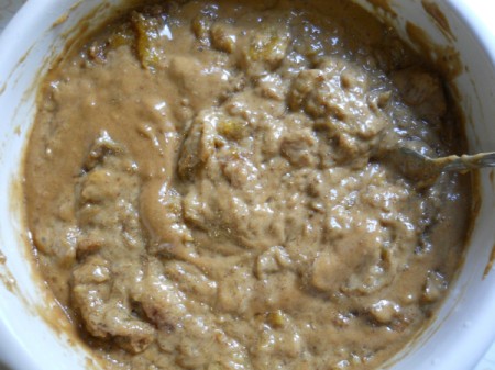 Stirring in broken walnuts.