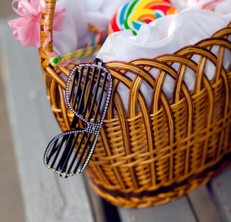 Pair of fun glasses sticking out of a gift basket.