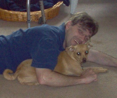 Man lying over dog.