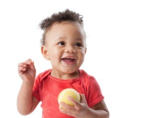 Toddler with ball.