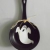 Ghost painted inside of case iron skillet.