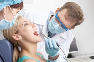 A woman at the dentist.
