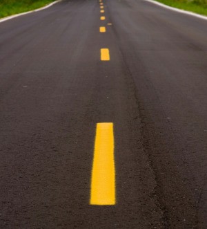 Road with freshly painted yellow lines.