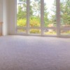 A room with light colored carpet.