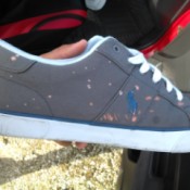 Bleach spots on gray fabric shoes.