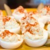 Deviled eggs being served as a holiday appetizer.