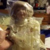 Ruth Mattingly doll with plastic over face and upper body.