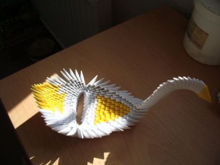 Yellow and white origami bird.