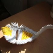 Yellow and white origami bird.